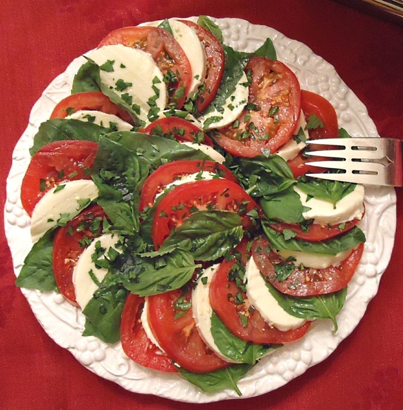 Nicely presented dish with the round segments of tomatoes creating a theme that is followed with the other ingredients